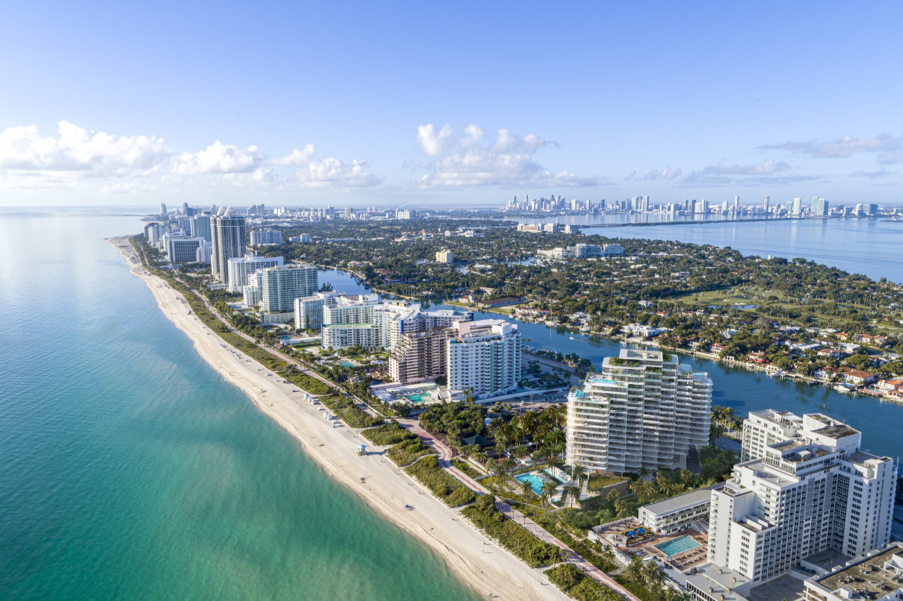 The Perigon Miami Beach — oceanfront residential tower by OMA at 5333 Collins Avenue, viewed from the Atlantic at dusk.