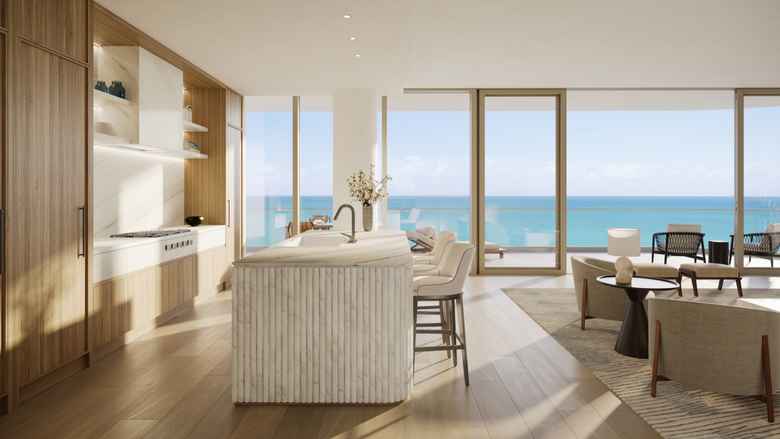 Custom Italian kitchen at The Perigon by Tara Bernerd & Partners — honed marble counters, backsplash, and island with Sub-Zero and Wolf appliances.