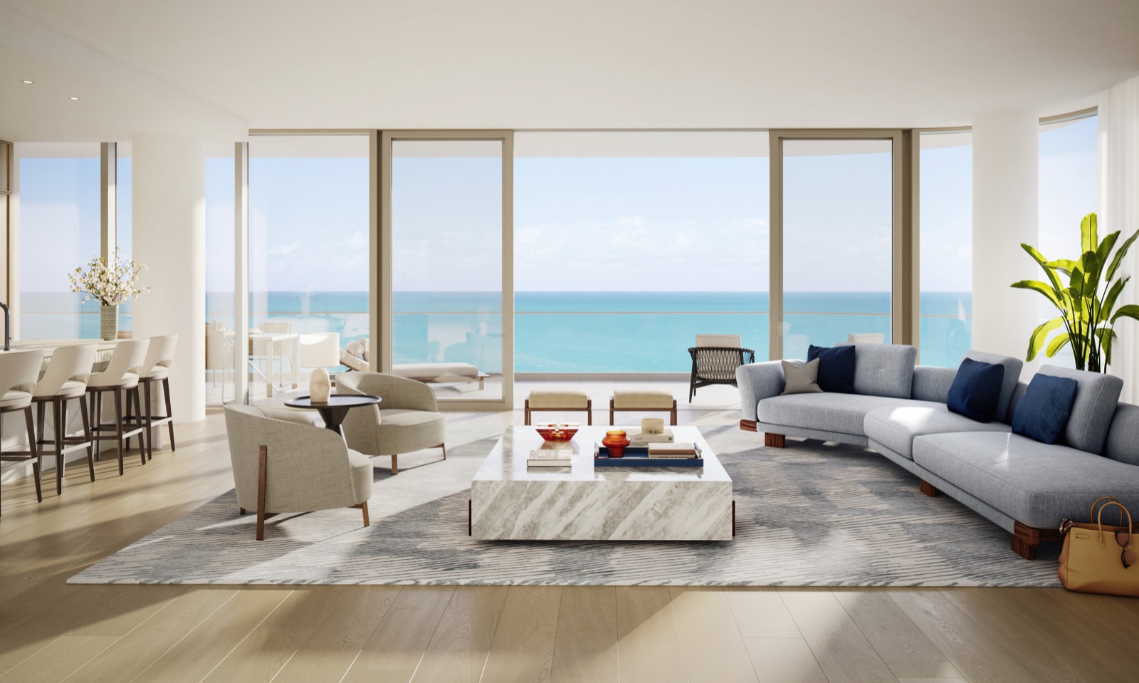 The Perigon great room — open-concept living, dining and entertaining area with 10-foot ceilings, floor-to-ceiling windows, and Atlantic views.